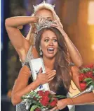  ?? AP ?? Cara Mund reacts after being named Miss America in 2017.