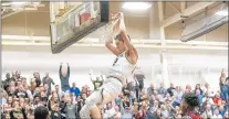  ?? CAMILLE FINE / DAILY SOUTHTOWN ?? Oak Forest’s Juan Avila throws down a dunk against Curie during a game on Feb. 22.