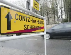  ?? VIRGINIA MAYO / THE ASSOCIATED PRESS ?? A sign tells travellers they are leaving Schengen, Luxembourg, where a deal was reached in 1985 to abolish border checks. That reform is now in danger.