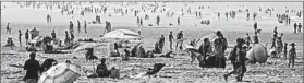  ?? PHILIPPE HUGUEN/GETTY-AFP ?? A wave of heat washes over French beach-goers Aug 25 in Calais — the 16th month in a row of record-breaking heat.