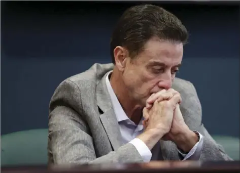  ?? AP PHOTO ?? Louisville basketball coach Rick Pitino listens during an NCAA college basketball news conference Thursday in Louisville, Ky.