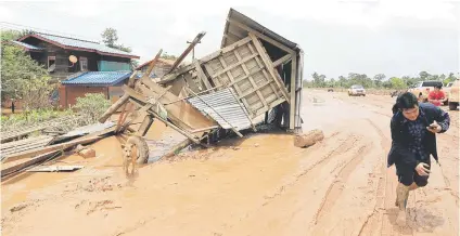  ?? Pictures: Reuters ?? DEVASTATIO­N. A damaged house on a street during the flood after the Xe-Pian Xe-Namnoy hydropower dam collapsed in Attapeu province, Laos, on Monday.