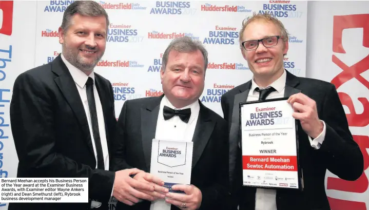  ??  ?? Bernard Meehan accepts his Business Person of the Year award at the Examiner Business Awards, with Examiner editor Wayne Ankers (right) and Dean Smethurst (left), Rybrook business developmen­t manager