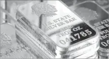  ??  ?? A SNEAK PEAK INSIDE SILVER VAULT BRICKS: Pictured left reveals for the very first time the valuable .999 pure fine silver bars inside each State Silver Vault Brick. Pictured right are the State Silver Vault Bricks containing the only U.S. State Silver...