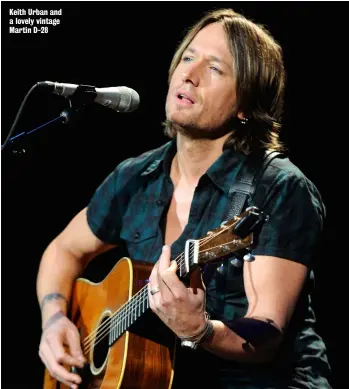  ??  ?? Keith Urban and a lovely vintage Martin D-28