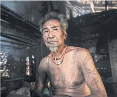  ?? AFP ?? Ngon Pok, 80, a tattooed Lainong tribesman, in his house in Sagaing region of Myanmar, wedged in a semi-autonomous zone near the Indian border.