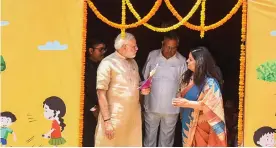  ?? — PTI ?? Prime Minister Narendra Modi visits an anganwadi centre in Bijapur, Chhattisga­rh, on April 14. State chief minister Raman Singh is also seen.