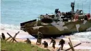  ??  ?? The Defense Ministry released dramatic footage of the land and sea maneuvers in Crimea