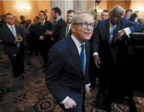  ?? PAUL VERNON — THE ASSOCIATED PRESS ?? Ohio Governor Mike DeWine enters the Ohio House chamber to deliver the Ohio State of the State address at the Ohio Statehouse. A divided federal appeals court Tuesday, March 12, upheld an Ohio anti-abortion law that blocks public money for Planned Parenthood.