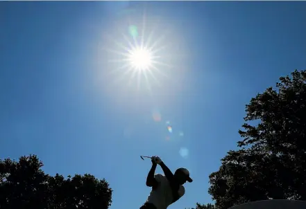  ?? GETTY IMAGES ?? Tiger Woods plays his shot from the 14th tee during a practice round for the PGA Championsh­ip.