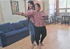  ??  ?? Geetha Sridha and her daughter Sarada Sridhar dance as they make a viral video.