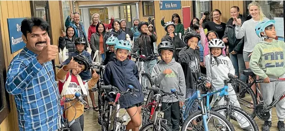  ?? ?? Fourteen children from former refugee families were gifted bikes at the weekend as part of a programme to help them become more independen­t and active.