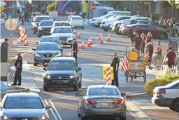  ??  ?? Vehicle and pedestrian traffic make its way to Sun Devil Stadium for Thursday night’s Pac-12 game between Arizona State and Stanford. Across the Valley, the Cardinals hosted the Denver Broncos in an NFL game.