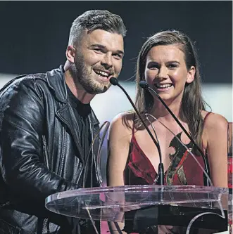  ?? Main picture / Jason Oxenham ?? Caleb Nott and Georgia Nott, of Broods, collect their second award on stage last year at the Vodafone NZ Music Awards at the Vector Arena.