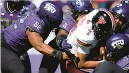  ?? RON JENKINS/AP ?? Texas Tech quarterbac­k Donovan Smith (7) is tackled by a host of TCU defenders on Saturday in Fort Worth, Texas.