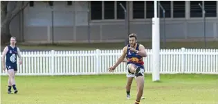  ??  ?? FORWARD THINKING: Mark Henning looks to find an open man for the USQ Cougars in their win over Coolaroo. Henning took home one vote in the best on ground.