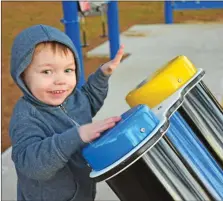  ?? STACI VANDAGRIFF/THREE RIVERS EDITION ?? Boston Powell, 2, bangs on the drums at the new sensory walk at Berryhill Park in Searcy on Tuesday. The walk was the brainchild of Kristi Thurmon, vice president for marketing for First Security Bank in Searcy. Bank employees raise funds for a charity or project each year, and they decided to do a sensory walk, working with Mike Parsons, parks director for the city of Searcy.