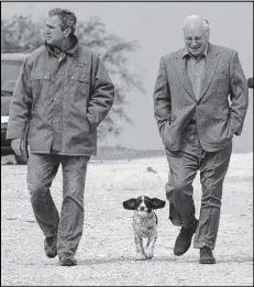  ?? ASSOCIATED PRESS ?? Then-Republican presidenti­al candidate Texas Gov. George W. Bush and running mate Dick Cheney walk down a dirt road to meet with reporters, followed by Bush’s dog Spot in 2001.