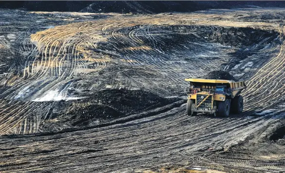  ?? JULIA KILPATRICK/WWW.PEMBINA.ORG ?? A heavy hauler truck makes its way across the Shell Albian Sands’ Jackpine mine, north of Fort McMurray. “I think it’s safe to say that we’re not looking at a return to booming growth,” said Michael Burt of the Conference Board of Canada. Still, a...