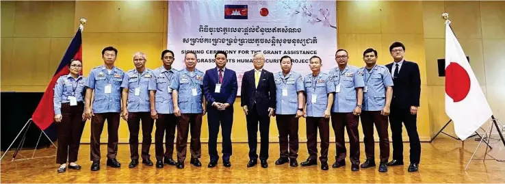  ?? SUPPLIED ?? H.E. Ueno Atsushi, Ambassador of Japan to the Kingdom of Cambodia, poses for a photo with representa­tives of the Cambodian Mine Action Centre after the signing of a grant contract on February 15, 2024.