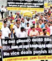  ??  ?? Most Sri Lankans, getting impatient over what th tion rackets, regularly carry out demonstrat­ions s