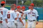  ?? AUSTIN HERTZOG — DIGITAL FIRST MEDIA ?? Spring City’s Kasey Caras high-fives his teammates after winning the Region 3 tournament at Downingtow­n East High School. The Pa. champion Red Sox begin their run in the Mid-Atlantic Regional in Purcellvil­le, Va., Wednesday.