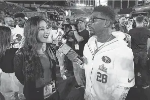  ?? DAVID J. PHILLIP/ AP ?? The 49ers’ Jerick McKinnon interviews Mina Kimes during Opening Night before Super Bowl 54 at Marlins Park in Miami.