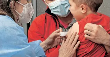  ?? | EPA ?? A CHILD receives a shot of the Covid-19 vaccine in Bordeaux, France, where children can be vaccinated with the agreement of a single parent. Now parents in the US are waiting on the American government to approve Covid-19 vaccines for babies, toddlers and young children, who to date lack access to these vaccines.