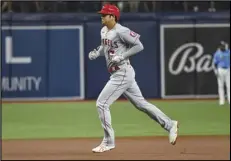  ?? Associated Press ?? ANOTHER HR — Angels designated hitter Shohei Ohtani circles the bases after hitting a solo home run off Tampa Bay Rays starter Andrew Kittredge during the first inning on Friday in St. Petersburg, Fla. It was his 24th homer of the year. The Angels lost 4-3.