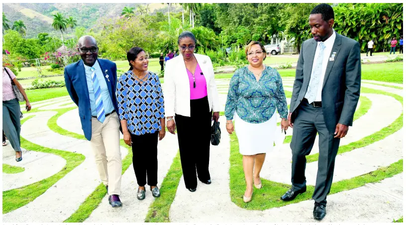  ?? RUDOLPH BROWN/PHOTOGRAPH­ER ?? From left: Walking in the Peace Garden are Dr Patrick Adizua, district governor, Rotary District 7020; Her Excellency Lady Allen; Dr Paticia Dunwell, custos of St Andrew; Hilary Coulton, public relations and administra­tive manager of CHASE Fund; and Kemmehi Lozer, president of the Rotary Club of St Andrew, after the official opening of Rotary Club of St Andrew Peace Garden at Hope Botanic Gardens on Thursday, March 28.