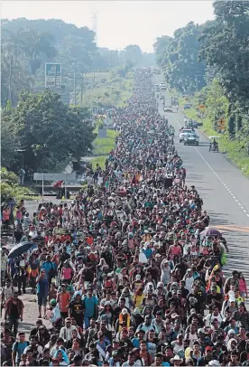  ?? MOISES CASTILLO THE ASSOCIATED PRESS ?? Central American migrants walking to the United States depart Ciudad Hidalgo, Mexico, Sunday. Their numbers swelled to about 5,000 overnight.