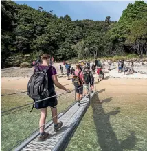  ?? BRADEN FASTIER/STUFF ?? New Zealand is a stunningly beautiful country, but looking after our national parks – including the ever-popular Abel Tasman – doesn’t come cheap. Elise Vollweiler