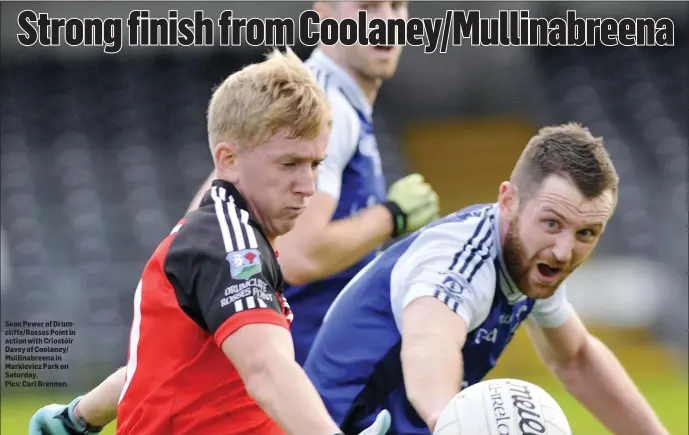  ??  ?? Sean Power of Drumcliffe/ Rosses Point in action with Criostóir Davey of Coolaney/ Mullinabre­ena in Markievicz Park on Saturday. Pics: Carl Brennan.