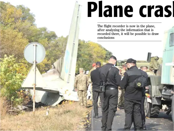  ?? SERGEY BOBOK/AGENCE FRANCE-PRESSE ?? MILITARY and experts work on the place of the Antonov-26 transport aircraft crash at Chuhuiv military air base around 30 kilometers southeast of Kharkiv, Ukraine.