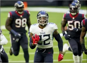  ?? MATT PATTERSON - THE ASSOCIATED PRESS ?? FILE - In this Jan. 3, 2021, file photo, Tennessee Titans running back Derrick Henry (22) carries the ball for a touchdown during an NFL football game against the Houston Texans in Houston.