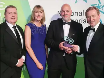  ??  ?? Minister Pat Breen, Sheelagh Daly from LEO Wicklow, Gordon O’Neill from Goldfish.ie and Taoiseach Enda Kenny at the National Enterprise Awards in the Mansion House in Dublin.