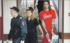  ?? Alexander Zemlianich­enko Associated Press ?? WNBA STAR Brittney Griner is escorted in a Russian courthouse in July.