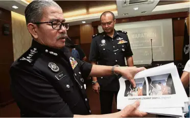  ??  ?? Drug lab: Comm Mazlan showing the entrance to the undergroun­d lab uncovered by police at a house in Taman Bukit Idaman, Batu Caves.