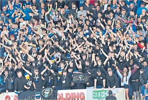  ?? April. ?? KEEPING THE FAITH: St Johnstone fans in good spirits during a match against Dundee at Dens Park in