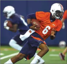  ?? JULIE BENNETT / The Associated Press ?? Auburn quarterbac­k Jeremy Johnson runs through a drill during a recent practice.