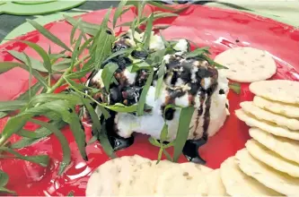  ?? SPECIAL TO THE EXAMINER ?? For Shari Darling's 'deconstruc­ted' meal, she prepared a ricotta cheese dip using fresh herbs from her garden.