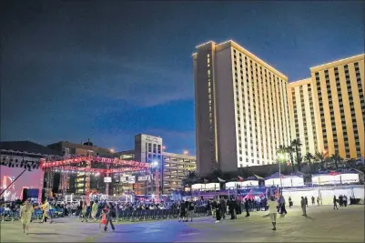  ?? FOLLOW @CSSTEVENSP­HOTO
CHASE STEVENS/LAS VEGAS REVIEW-JOURNAL ?? People walk around the Downtown Las Vegas Events Center before the start of a boxing match Friday.