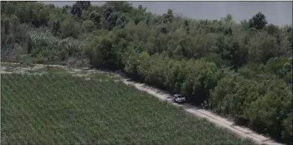  ?? AP PHOTO/ERIC GAY ?? In this July 24, 2014, file photo, a Customs and Border Protection vehicle patrols on the Texas border near the Rio Grande in Mission, Texas.