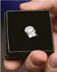  ??  ?? Murray is honored with a Silver Snoopy pin — an award given to, for and by NASA astronauts.