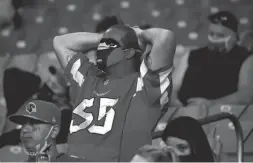  ?? PATRICK BREEN/THE REPUBLIC ?? Cardinals fans react as the team loses the lead late in the fourth quarter against the Bills at State Farm Stadium in Glendale on Nov. 15.