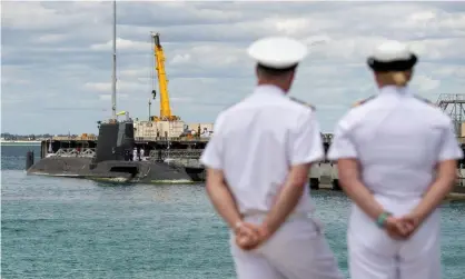  ?? Photograph: Richard Wainwright/EPA ?? A British nuclear-powered submarine docks in Perth. Building Australia’s own nuclear submarine fleet under the Aukus deal could cost up to $171bn.