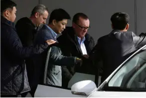  ?? — Reuters ?? Tense diplomacy: Feltman (second from right) arriving at Beijing airport after his return from North Korea.