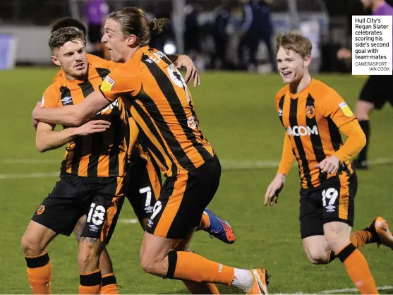  ?? CAMERASPOR­T - IAN COOK ?? Hull City’s Regan Slater celebrates scoring his side’s second goal with team-mates