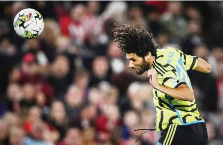  ?? File/AFP ?? Egyptian midfielder Mohamed Elneny heads the ball during a match between Brentford and Arsenal at the Brentford Community Stadium in London.