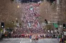  ?? Photograph: AFP/Getty Images ?? On your marks, get set … runners off to a flying start during Sydney’s City2Surf.